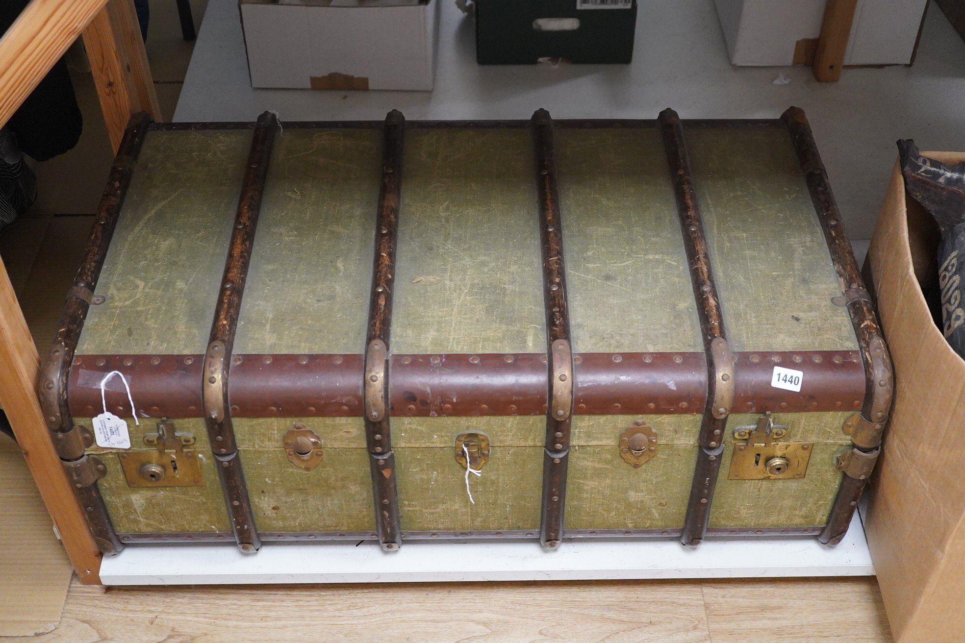 A steamer trunk and a leather Gladstone bag, trunk 63cm wide. Condition - fair